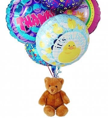 teddy bear inside a clear balloon